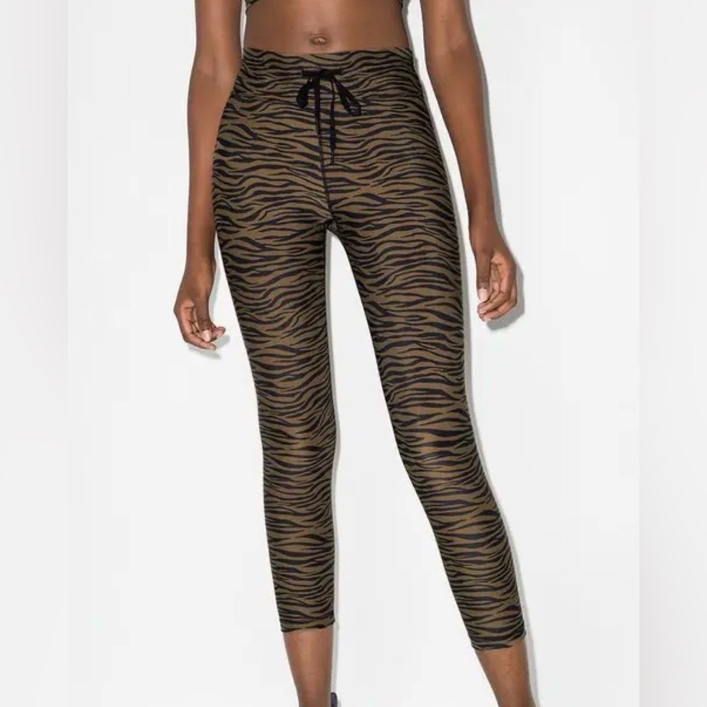 The Upside Malibu Tiger Midi Pants in an olive brown tiger
